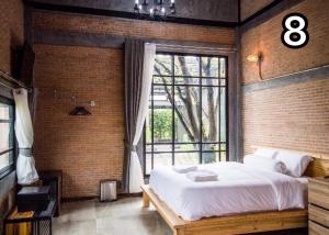 Postel nebo postele na pokoji v ubytování Na Klongluang Boutique Resort