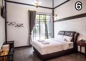 Postel nebo postele na pokoji v ubytování Na Klongluang Boutique Resort