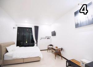 Postel nebo postele na pokoji v ubytování Na Klongluang Boutique Resort