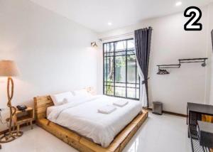 Postel nebo postele na pokoji v ubytování Na Klongluang Boutique Resort
