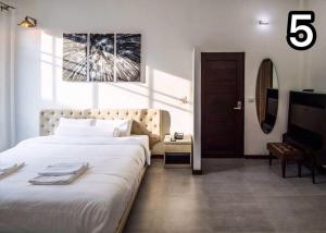 Postel nebo postele na pokoji v ubytování Na Klongluang Boutique Resort