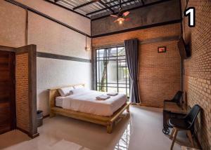 Postel nebo postele na pokoji v ubytování Na Klongluang Boutique Resort