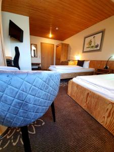Postel nebo postele na pokoji v ubytování Hotel in den Herrnwiesen