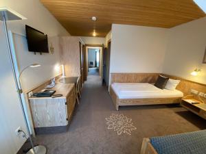 Postel nebo postele na pokoji v ubytování Hotel in den Herrnwiesen
