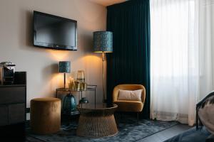 TV a/nebo společenská místnost v ubytování Hotel Britannique