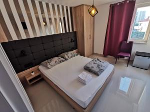 Postel nebo postele na pokoji v ubytování Elizabeta Deluxe Rooms