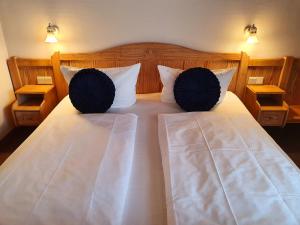 Postel nebo postele na pokoji v ubytování Hotel in den Herrnwiesen