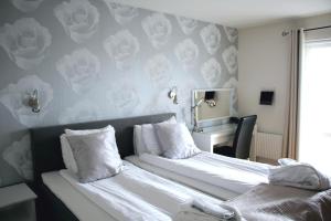 Hotel Carlshamn 객실 침대
