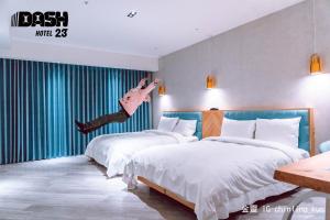 Postel nebo postele na pokoji v ubytování Dash 23 Hotel