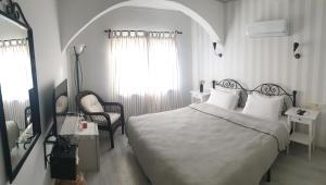 Postel nebo postele na pokoji v ubytování A&B Home Hotel