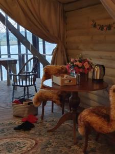 a room with a table and two chairs and a table and a table at Tedesco Eco Park in São Francisco de Paula