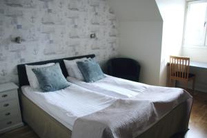 Hotel Carlshamn 객실 침대