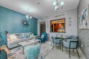 a living room filled with furniture and a fireplace at Bella Vista - 29 Boulevard Downtown Burj Khalifa in Dubai