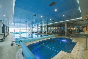 a large swimming pool on a cruise ship at Hotel Villa Ekaterina in Vakarel