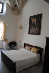 A bed or beds in a room at B & B Palazzo Maestro & Corte Maestro rooms Még 22 kép