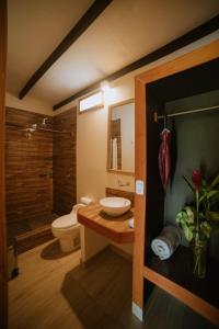 a bathroom with a toilet and a sink and a shower at El Sauce Resort - Hotel Asociado Casa Andina in Sauce