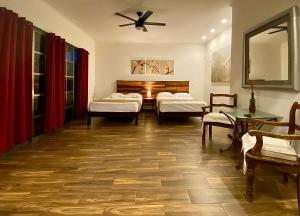 
Ein Bett oder Betten in einem Zimmer der Unterkunft Cancun-Soho B&B
