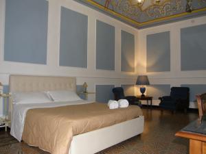 A bed or beds in a room at Il Gattopardo House