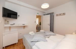 Postel nebo postele na pokoji v ubytování Apinelo + 1 fotografie
