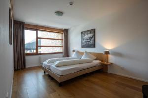 Postel nebo postele na pokoji v ubytování Marina Walensee Hotel