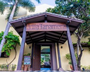 a sign for the entrance to the villa tarantanza at Villa Tanamera in Bangrak Beach