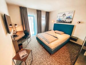 Postel nebo postele na pokoji v ubytování Hotel Schwertfirm