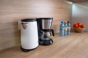 a blender sitting on a counter in a kitchen at Nadmorski Szept in Dziwnówek +13 photos