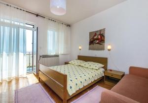 En eller flere senge i et værelse på Apartment Dari - with terrace