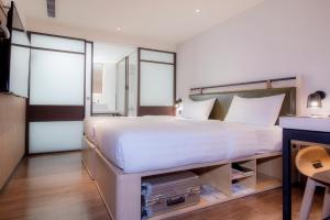 Ένα ή περισσότερα κρεβάτια σε δωμάτιο στο City Suites - Main Station