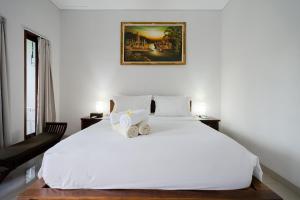 WIRA Homestay & Spa客房内的一张或多张床位