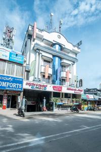 a building on the corner of a street at Aishwarya Le Royal in Mysore