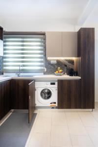A kitchen or kitchenette at Sleeping Beauty Apartment City Center!!