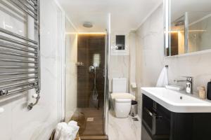 A bathroom at Sleeping Beauty Apartment City Center!!