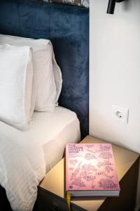 A bed or beds in a room at Sleeping Beauty Apartment City Center!!