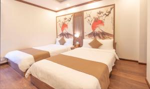 Postel nebo postele na pokoji v ubytování Khai Ngoc Hotel Da Lat City