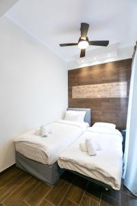 A bed or beds in a room at Sleeping Beauty Apartment City Center!!