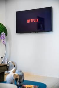 A television and/or entertainment centre at Sleeping Beauty Apartment City Center!!