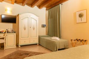 Posteľ alebo postele v izbe v ubytovaní Agriturismo dei Grippi