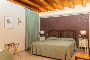 Posteľ alebo postele v izbe v ubytovaní Agriturismo dei Grippi
