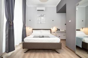 A bed or beds in a room at Clementi 18 Suites Rome