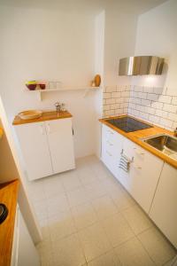 Kuchyň nebo kuchyňský kout v ubytování MEDANO4YOU Magallanes Flavour Holiday Home
