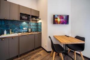 Kuchyň nebo kuchyňský kout v ubytování Secret Apartments