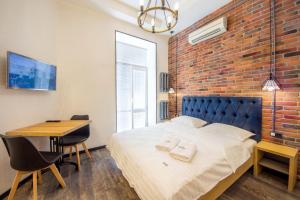Postel nebo postele na pokoji v ubytování Secret Apartments