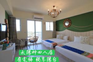 Postel nebo postele na pokoji v ubytování 花蓮雲朵朵民宿 電梯附停車場