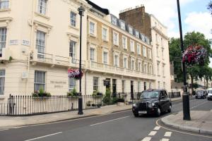 a black car parked in front of a building at Sheriff Hotel in London
