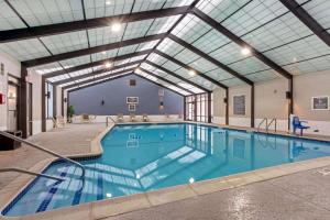 a swimming pool with a pool table in it at La Quinta by Wyndham Boston-Andover in Andover