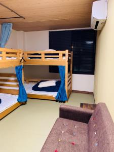 Postel nebo postele na pokoji v ubytování Hilo Hostel