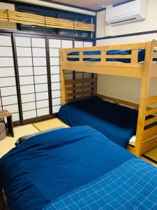 Postel nebo postele na pokoji v ubytování Hilo Hostel