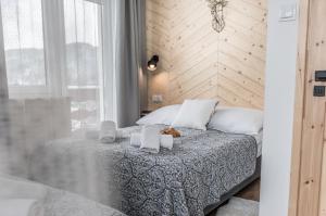 Posteľ alebo postele v izbe v ubytovaní Apartamenty Smrekowa Turnia
