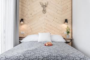 Posteľ alebo postele v izbe v ubytovaní Apartamenty Smrekowa Turnia